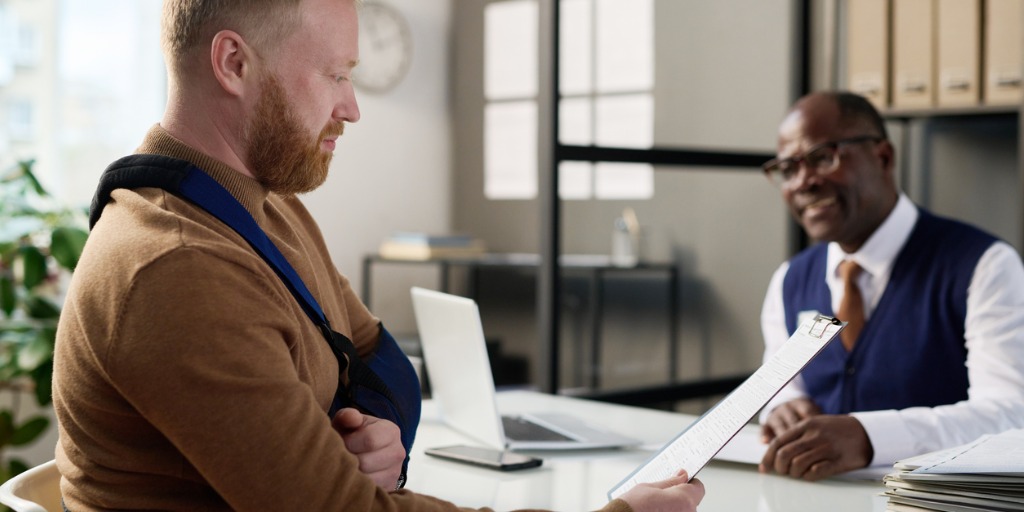 Long Beach personal injury attorney meeting with an injured client